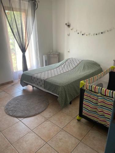Posteľ alebo postele v izbe v ubytovaní Appartement au calme au milieu du vignoble de Gigondas