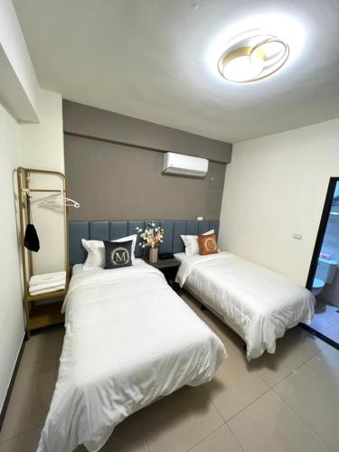 Ένα ή περισσότερα κρεβάτια σε δωμάτιο στο Haoyue Hotel
