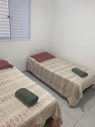 Giường trong phòng chung tại Ap térreo