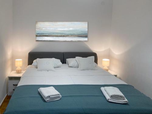 Ένα ή περισσότερα κρεβάτια σε δωμάτιο στο Apartments Majda