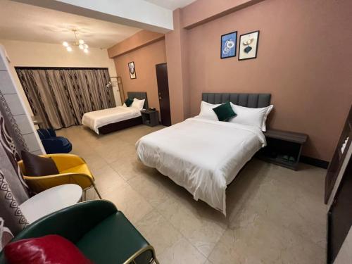 Ένα ή περισσότερα κρεβάτια σε δωμάτιο στο Haoyue Hotel