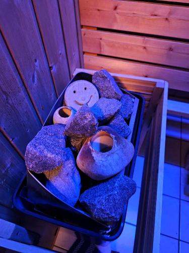 a tray of purple pastries with a teddy bear on it at Wohnung mit Privtbad in Gaggenau