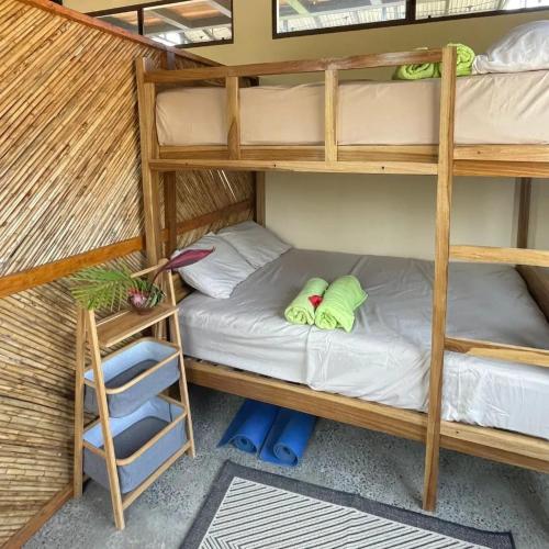 a bunk bed in a room with a bunk bedutenewayangering at Four Trees Jungle Lodge in San Juan del Sur
