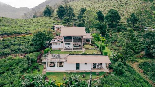 an aerial view of a house on a hill at Hill Safari - Tea Estate Villa in Ohiya