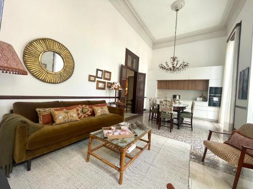 a living room with a couch and a table at Casa Colonial El Indiano in Las Palmas de Gran Canaria
