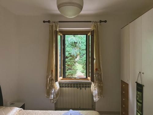 Postel nebo postele na pokoji v ubytování Casa con giardino in Mugello a 30 minuti da Firenze "SoleLuna"