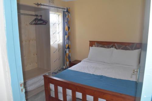 Katil atau katil-katil dalam bilik di Berur Homes