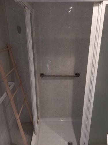 a shower with a glass door in a bathroom at FirstLine BeachView in El Campello