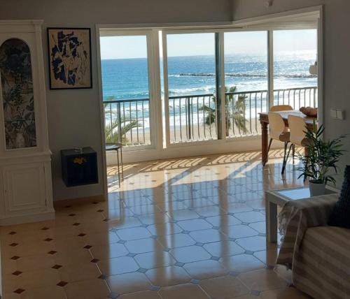 a living room with a view of the ocean at FirstLine BeachView in El Campello