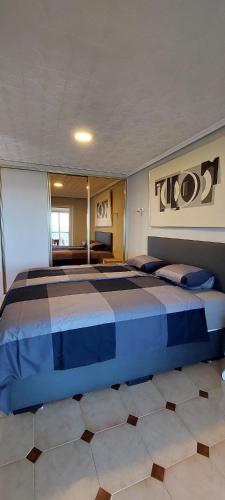 a bedroom with a large bed in a room at FirstLine BeachView in El Campello