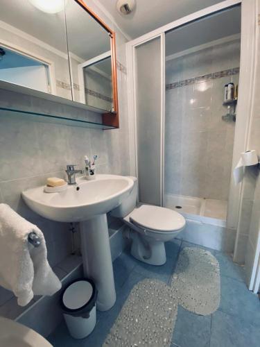 a bathroom with a white sink and a toilet at Pretty flat 2mn from beach in Nice
