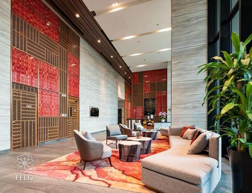 a lobby with couches and chairs on a rug at Feliz en Vista New Duplex 2br Highclass in Ho Chi Minh City