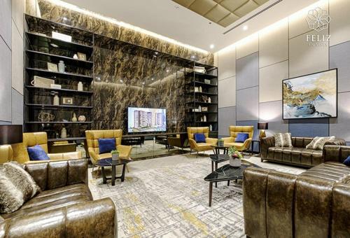 a living room with couches and chairs and a television at Feliz en Vista New Duplex 2br Highclass in Ho Chi Minh City