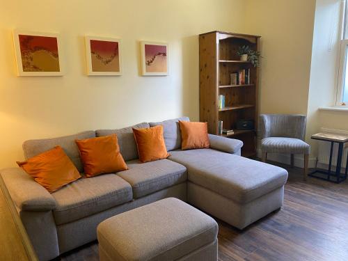 a living room with a couch and a chair at Church View House in Kells