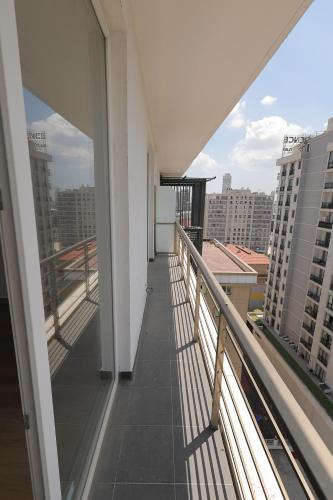 a balcony with a view of a city at Cozy Homes 1 Room 1 Living room Apartment in Esenyurt