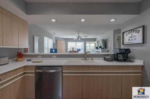 a kitchen with a sink and a counter top at 2BR WALK-IN - Golf Course View - Centrally Located - FREE TICKETS INCLUDED - FW11-3 in Branson