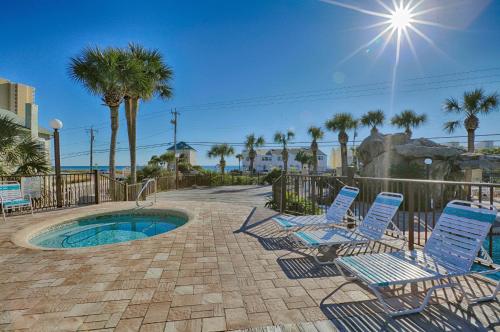 a group of chairs sitting next to a pool at Portside Resort by Panhandle Getaways in Panama City Beach