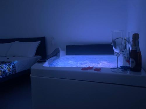 a bedroom with a bed with a blue light at Brezza di Stabia Rooms in Castellammare di Stabia