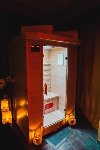 an open refrigerator with lights inside of it at HomeSparadise in Besançon