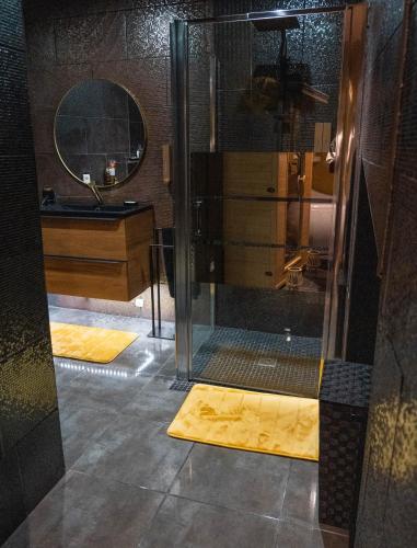 a bathroom with a shower and a sink at HomeSparadise in Besançon