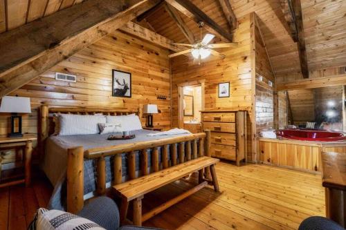 Una cama o camas en una habitación de Our Deer Hideout - Couples retreat, hot tub, foosball, arcade