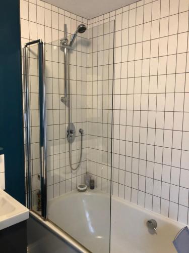a shower with a glass door in a bathroom at Balcarres, Rodborough Avenue in Stroud