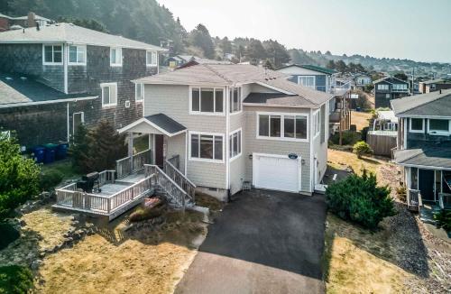 an aerial view of a white house with a garage at Oceana House in Lincoln City