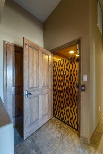 a wooden door with a gate in a room at Majestic Mountain Escape-hike trails from backyard in Albuquerque