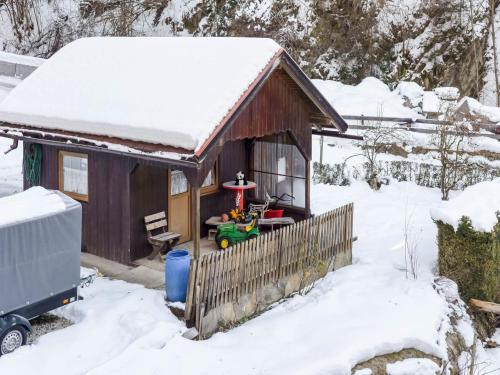 a snow covered house with a toy in it at Apartment Feld am See near Feldsee Lake in Feld am See