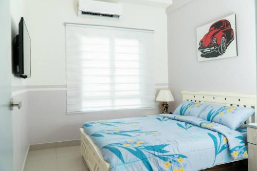 a white bedroom with a bed and a window at Miro Resthouse by the Pool in Kajang