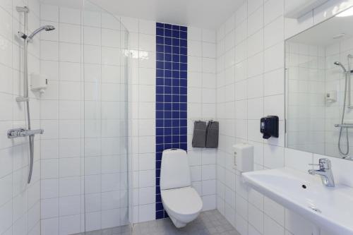 a bathroom with a toilet and a sink and a shower at Sure Hotel by Best Western City Jonkoping in Jönköping