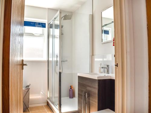 a bathroom with a shower and a sink at 10 Castaway-uk45095 in Kessingland