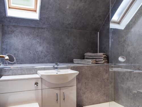 a bathroom with a sink and a shower at Beechwood in Arrochar