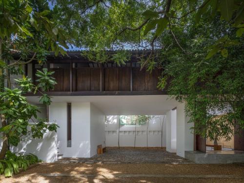 an external view of the garage of a house with trees at Three Gables Boutique Villa in Mirissa