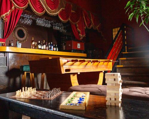 a bar with a table with a chess set on it at Union Hotel Cusco in Cusco