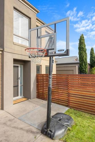 a basketball hoop in front of a house at Paperbark Escape in Inverloch