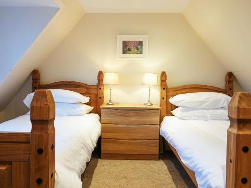 Posteľ alebo postele v izbe v ubytovaní Seaforth Cottage