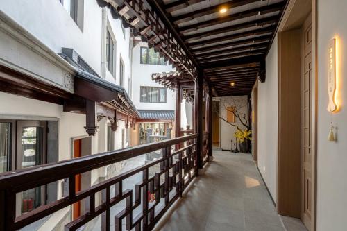 a corridor of a building with a balcony at Zunjing Boutique Hotel Nanjing Confucius Temple in Nanjing