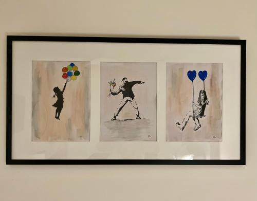three paintings of a man and a woman with balloons and balloons at KK Athens Fine Stay-Steps to Metro-Modern & Cozy Apartments in Athens
