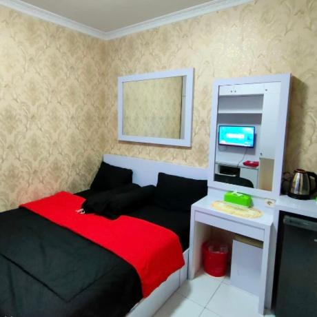 Un pat sau paturi într-o cameră la Salifa Rooms