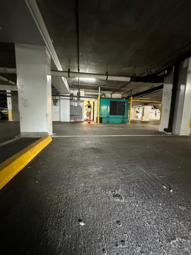 an empty parking lot in an empty parking garage at WELLCOME TO LOVELY CONDO 2 BEDS 2 BATHS FREE PARKING IN WAIKIKI BEACH in Honolulu