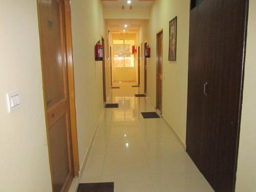 a corridor of a building with a hallway at Hotel Krishna Rishikesh in Rishīkesh