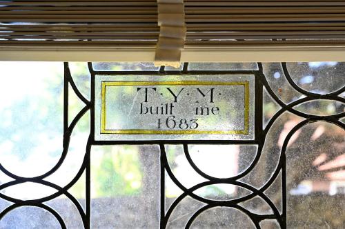a window with a sign that says try to build me at Walnut Tree House in Rustington