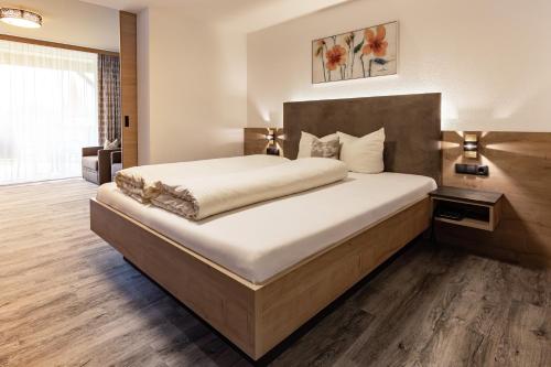 Un ou plusieurs lits dans un hébergement de l'établissement Das Aparthotel Olympia Tirol