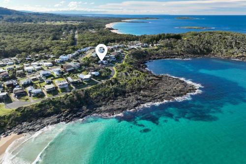 an aerial view of a resort next to the ocean at Shelly's Waterfront Property - Brand New in Kioloa