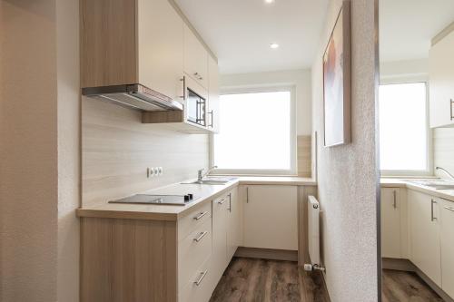 Cuisine ou kitchenette dans l'établissement Das Aparthotel Olympia Tirol