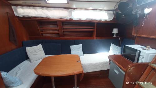 a small room with a bed and a table at Best Barcelona boat experience in Barcelona