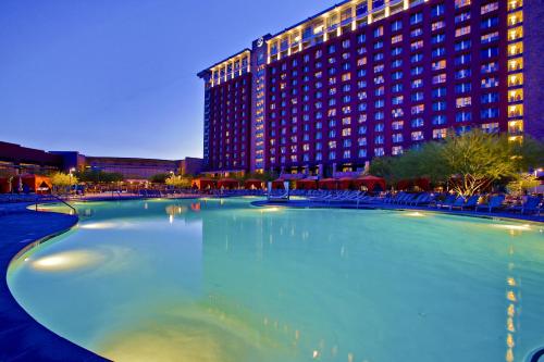 a large swimming pool in front of a hotel at Talking Stick Resort in Scottsdale