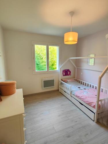 Photo de la galerie de l'établissement Villa entre ville et océan avec piscine chauffée, à Saint-Aubin-de-Médoc