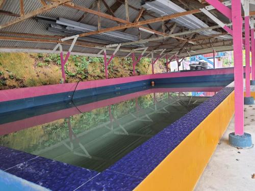a large pool of water in a building at Tmn Rekreasi Cikgu Haron in Labis